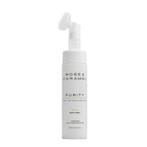 White bottle branded Rose & Caramel tan remover with a white background.