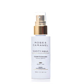 White bottle with gold lid branded Rose & Caramel, facial spritz with a white background.