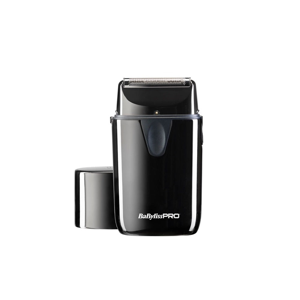 A black BaByliss PRO single foil shaver with UV disinfection feature, displayed alongside its cap and charging port.