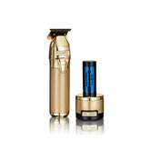 BaByliss PRO FXONE Skeleton GOLD hair trimmer with interchangeable lithium battery pack, showcasing an ergonomic design and a gold-tone metal housing.
