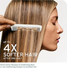 A close-up side profile of a woman with long, straight, light brown hair being combaged by a hand holding a white comb. Large text reads 'UP TO 4X SOFTER HAIR AFTER ONE USE.