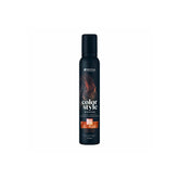 Indola Color Style Mousse Copper 200ml is shown centered against a clean white background.The sleek, dark bottle features vibrant orange and copper graphic accents .