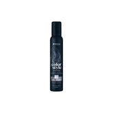 The bottle features the white Indola logo at the top, followed vertically by the product name "color style MOUSSE" written in stylized fonts. A rectangular image swatch on the front label displays a glossy texture of wavy hair, indicating the product's shade. The bottom text specifies the bottle size as 200ml.