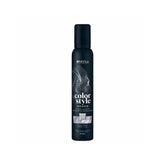 The bottle features the white Indola logo at the top, followed vertically by the product name "color style MOUSSE" written in stylized fonts. A rectangular image swatch on the front label displays a glossy texture of wavy hair, indicating the product's shade. The bottom text specifies the bottle size as 200ml.