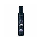 The bottle features the white Indola logo at the top, followed vertically by the product name "color style MOUSSE" written in stylized fonts. A rectangular image swatch on the front label displays a glossy texture of wavy hair, indicating the product's shade. The bottom text specifies the bottle size as 200ml.