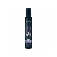 The bottle features the white Indola logo at the top, followed vertically by the product name "color style MOUSSE" written in stylized fonts. A rectangular image swatch on the front label displays a glossy texture of wavy hair, indicating the product's shade. The bottom text specifies the bottle size as 200ml.