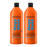 Two orange Matrix Mega Sleek hair care bottles on a white background, one smoothing shampoo and one smoothing conditioner.