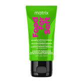 A squeeze tube of Matrix Food For Soft detangling hydrating conditioner, featuring a bright lime green body with bold pink text and a black cap, set against a plain white background.