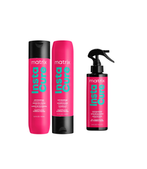 A set of hair care products from Matrix, including a pink shampoo bottle, a pink conditioner bottle, and a black spray bottle.