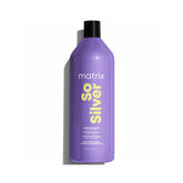 Purple Matrix So Silver shampoo bottle with black cap on a purple background.