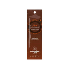 A 15ml sachet of Australian Gold Dark Sunshine tanning lotion with a brownish-gold color scheme and product information on the front.