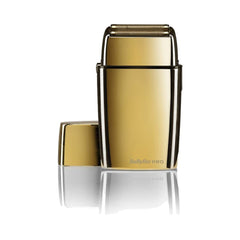 A gold-colored BaByliss PRO cordless dual foil shaver.