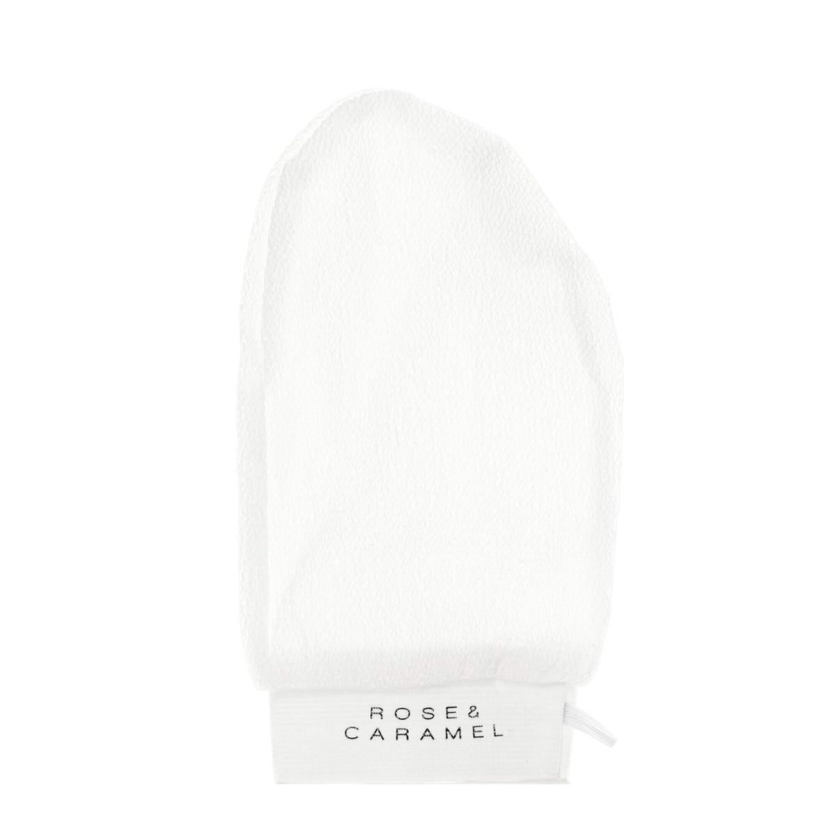 White exfoliating tanning mitt branded Rose & Caramel.
