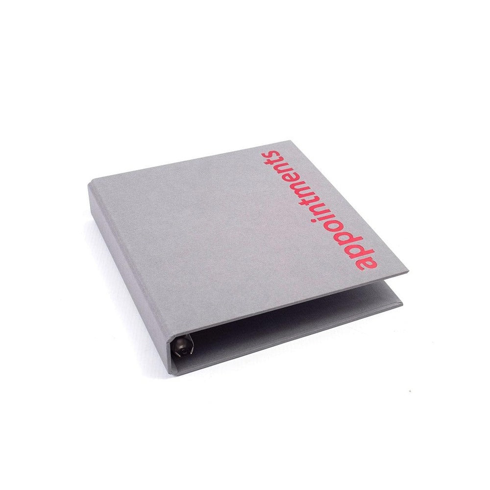 Grey binder on a white background. 