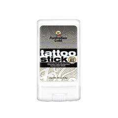 Australian Gold Tattoo Stick SPF 50+ in a white dispenser stick with black and gold design elements.