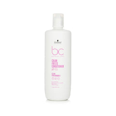 A bottle of BC Color Freeze Conditioner, 1000ml, with white and pink label, designed for color-treated hair.