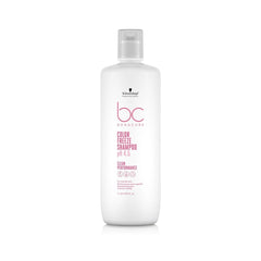 A bottle of BC Color Freeze Shampoo by Schwarzkopf, with a white label and pink accents.