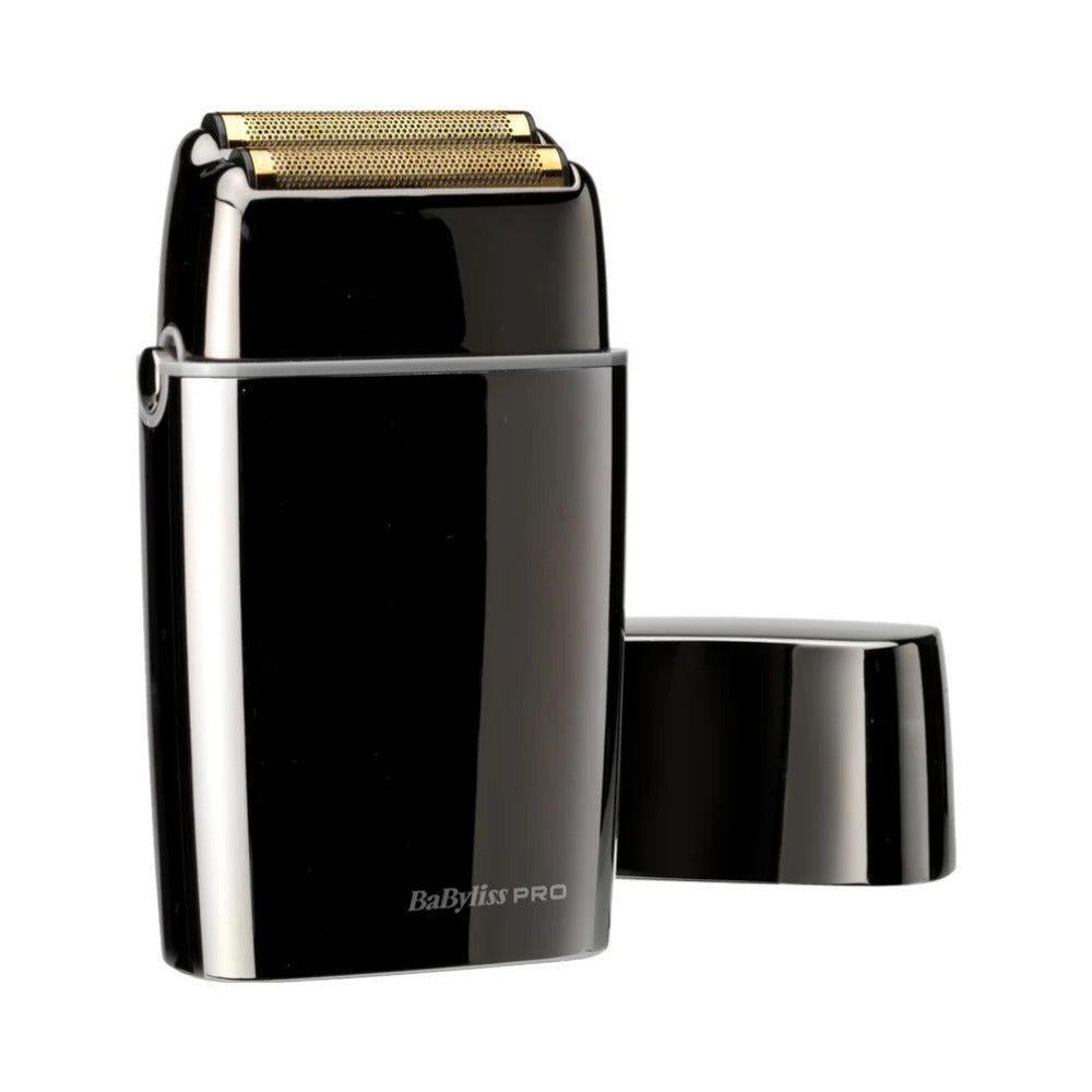 Dual foil shaver with the lid next to it on a white background. 