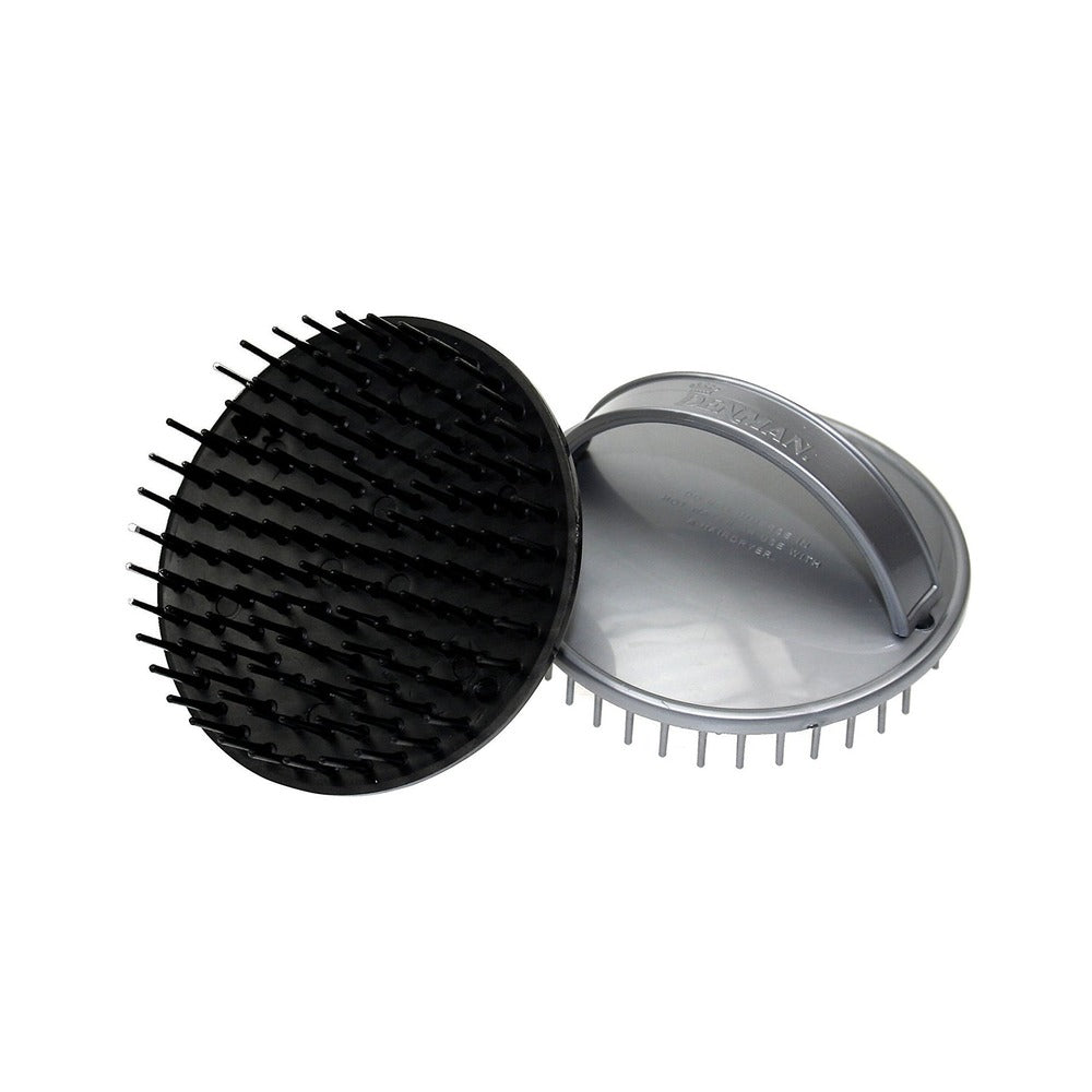 A black and silver circular palm-sized hairbrush with flexible, round-ended pins.