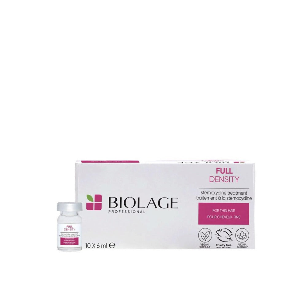 A box of Biolage Full Density Stemoxidine hair thickening treatment. The packaging is predominantly white with pink and black accents, and includes an image of the product bottle and the Matrix Biolage logo.