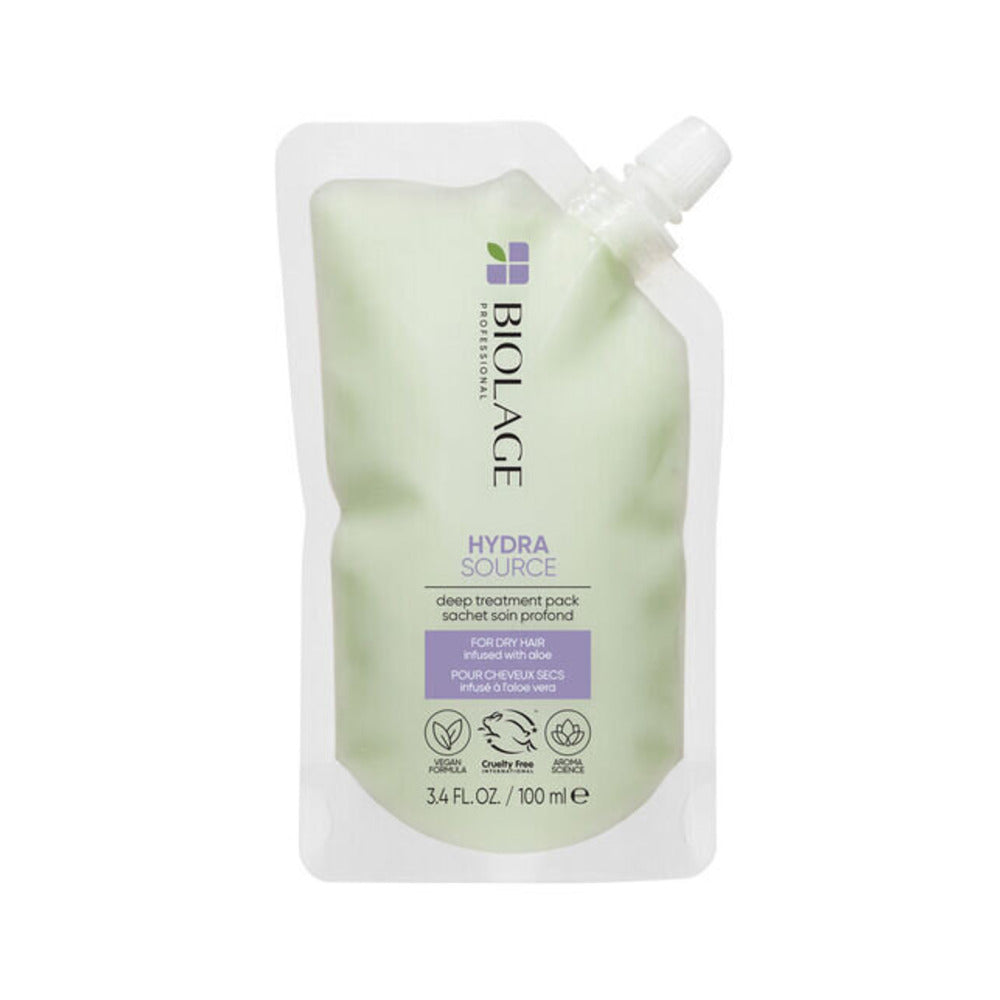 A pouch of Biolage Hydrasource Deep Treatment Pack, with a greenish tint and the product information displayed on the front.