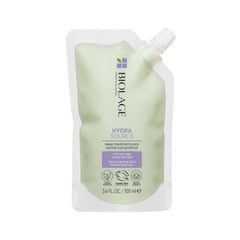 A pouch of Biolage Hydrasource Deep Treatment Pack, with a greenish tint and the product information displayed on the front.