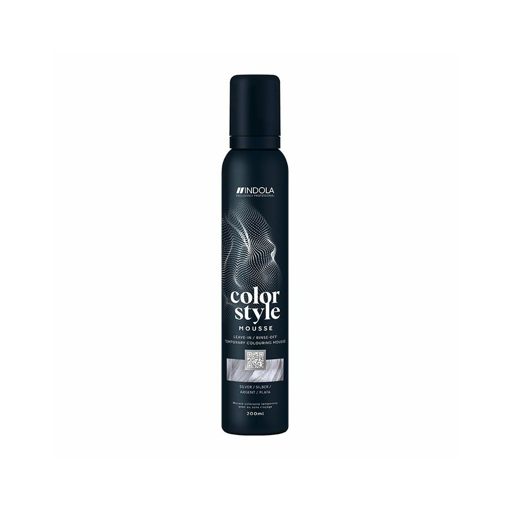 The bottle features the white Indola logo at the top, followed vertically by the product name "color style MOUSSE" written in stylized fonts. A rectangular image swatch on the front label displays a glossy texture of wavy hair, indicating the product's shade. The bottom text specifies the bottle size as 200ml.
