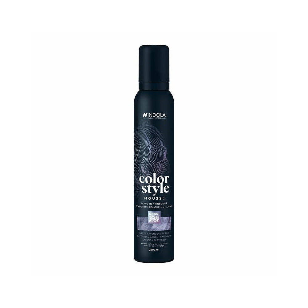 The bottle features the white Indola logo at the top, followed vertically by the product name "color style MOUSSE" written in stylized fonts. A rectangular image swatch on the front label displays a glossy texture of wavy hair, indicating the product's shade. The bottom text specifies the bottle size as 200ml.
