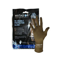 A retail package and a displayed pair of Matador Professional Re-usable Protective Gloves. The package features bold white branding on a dark background, while a single brown latex glove is shown standing upright to display its texture and fit.
