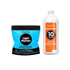 A bag of Matrix Light Master 8 and a bottle of Matrix 10 Volume developer on a plain white background.