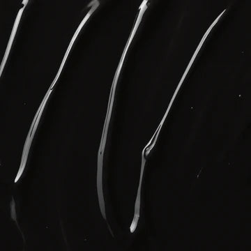 A close-up of glossy black material with several curved, reflective streaks running diagonally across the frame.