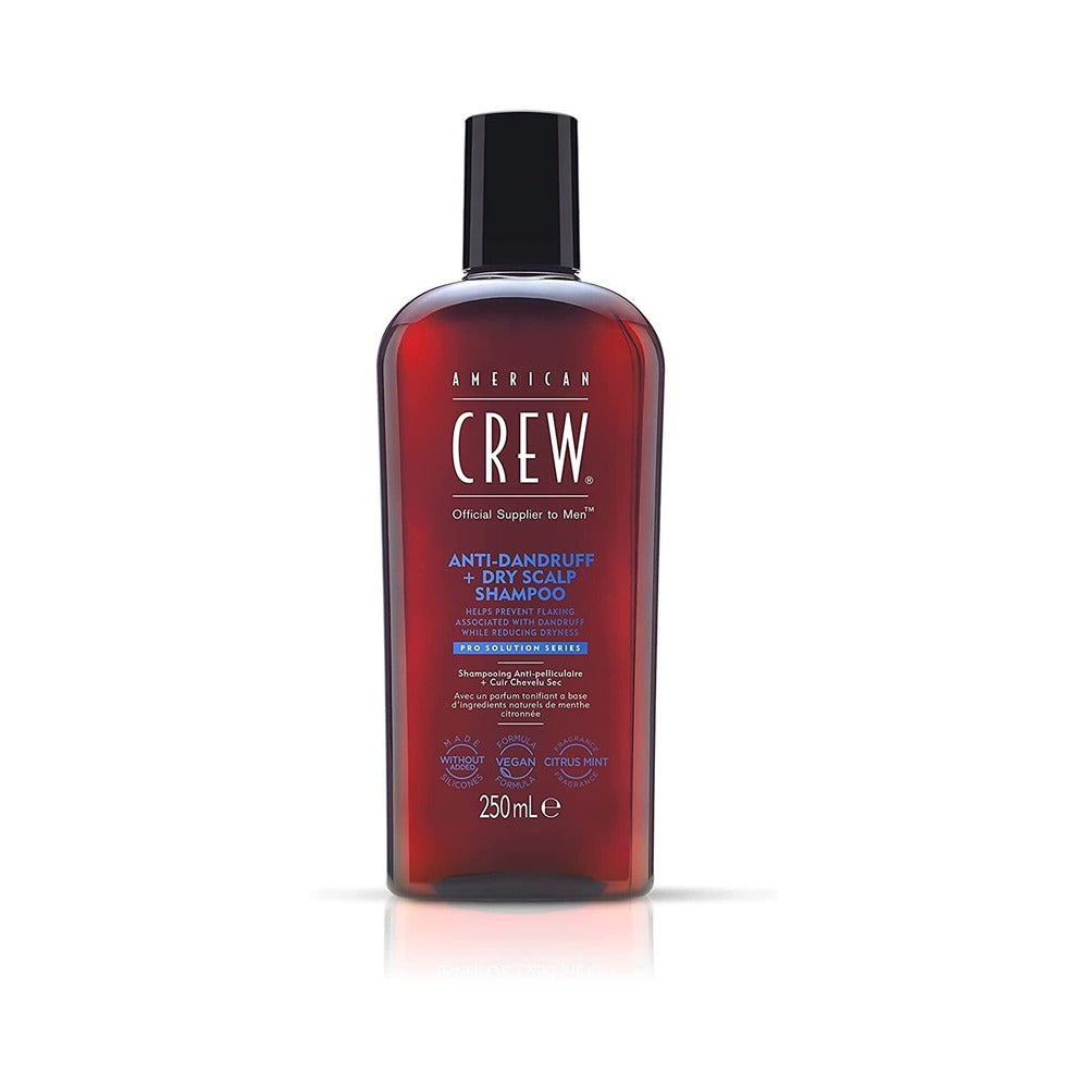 American Crew Anti-Dandruff + Dry Scalp Shampoo in a red bottle with a black cap, containing 250ml of product.