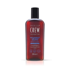 American Crew Anti-Dandruff + Dry Scalp Shampoo in a red bottle with a black cap, containing 250ml of product.