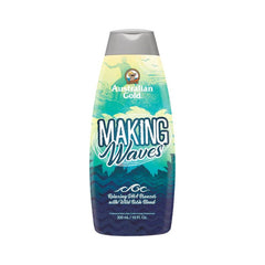Bottle of Australian Gold Making Waves tanning lotion with a blue and yellow label featuring a surfboard graphic.