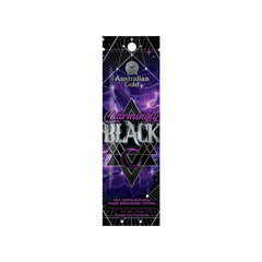 Australian Gold Charmingly Black sachet for tanning lotion, with a predominantly purple design featuring product information and branding.