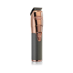 BaByliss PRO cordless hair trimmer in rose gold color with a grey handle.